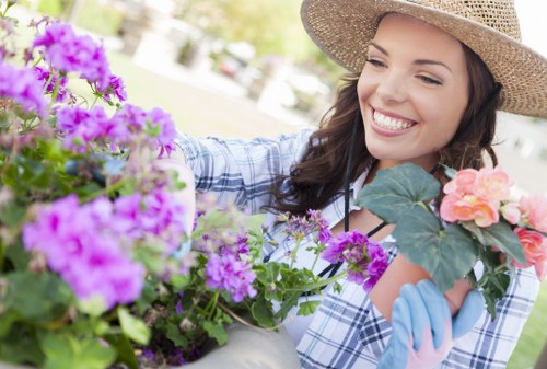 Gardener reviewing a service complaint in a garden setting